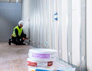 Electrician installing cable